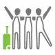 A group of three friends standing hand in hand with a suticase excited for their vacation