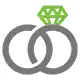 Two rings interlinked with each other symbolizing a marriage between a bride & a groom
