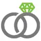 A pair of wedding rings synced together with a diamond atop one of them. 