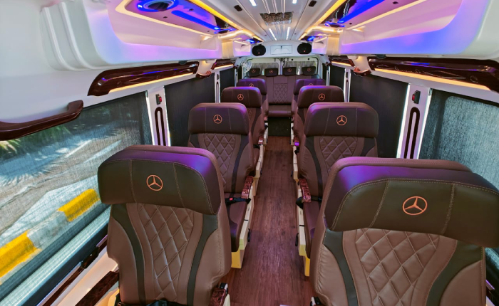 Luxury Maharaja tempo traveller interior with push-back seats in Delhi