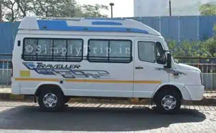 A white classic force traveller that is parked with its front to its left