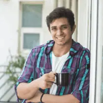 A middle aged man with sunglasses and a red shirt